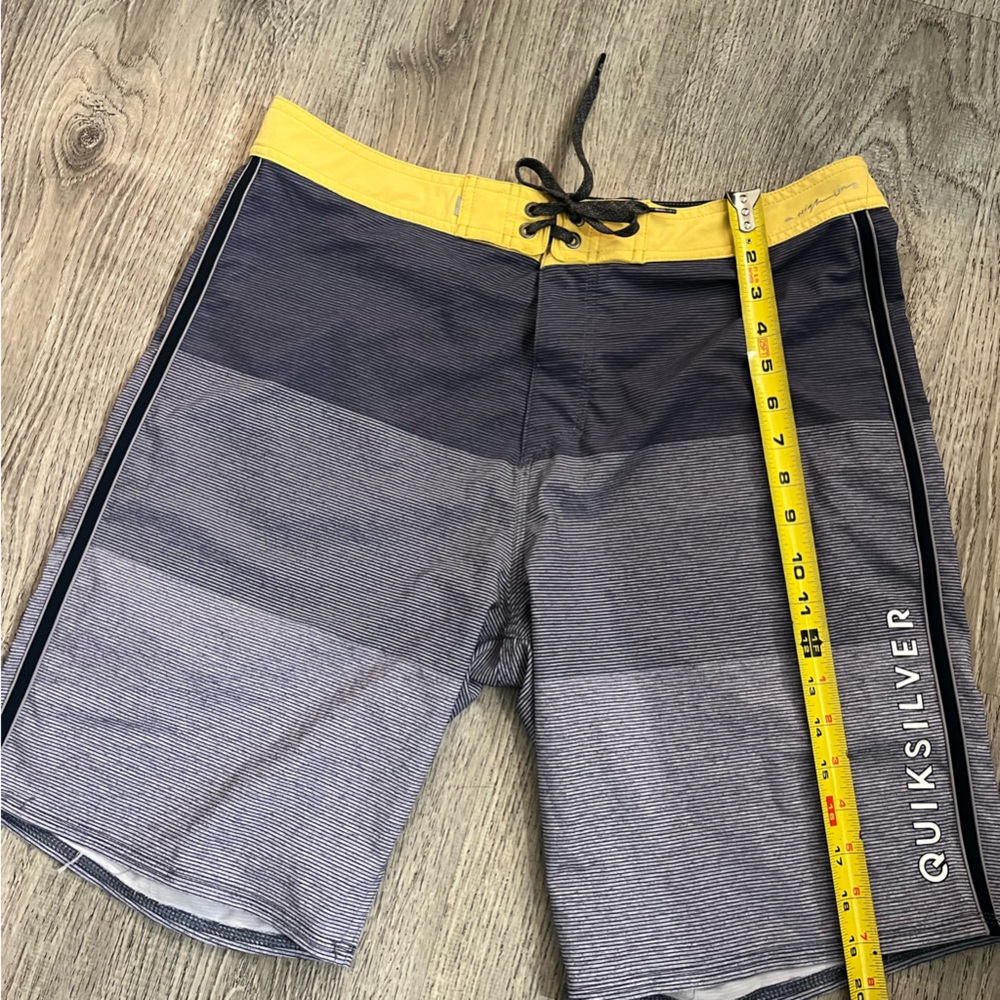 Quiksilver Yellow and Gray Board Shorts with Color-Blocked Design